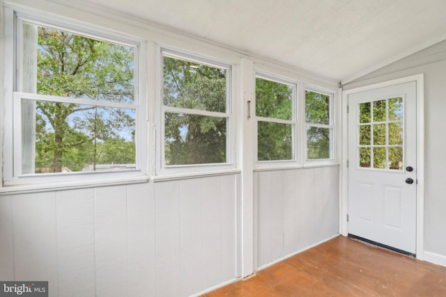 unfurnished sunroom with lofted ceiling and a wealth of natural light