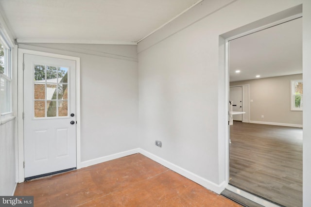 interior space featuring hardwood / wood-style floors and vaulted ceiling