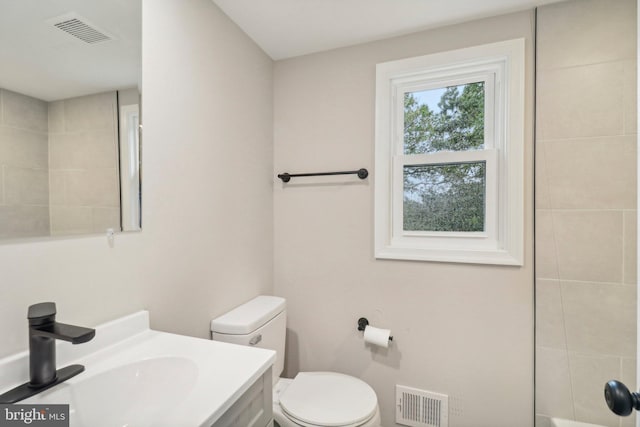 bathroom with vanity and toilet