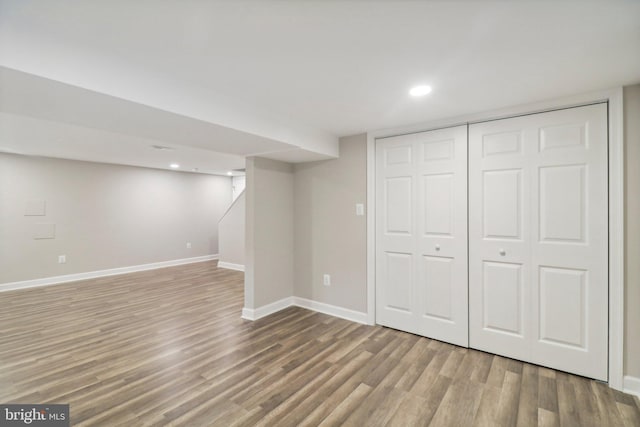 basement featuring hardwood / wood-style floors