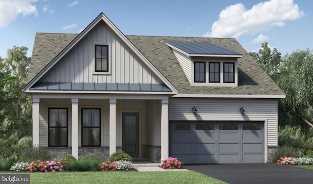 view of front of house featuring a porch and a garage