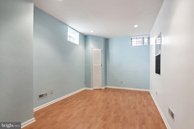 basement featuring light hardwood / wood-style flooring