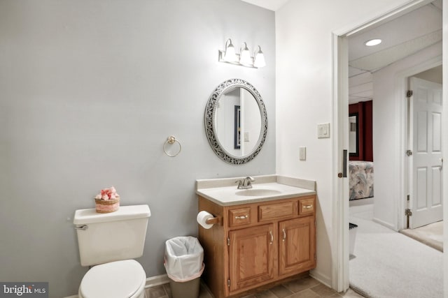 bathroom with vanity and toilet