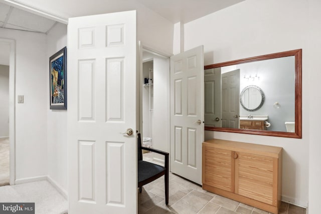 interior space featuring tile patterned flooring and sink