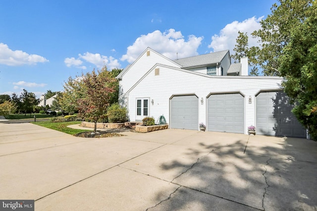 view of side of property featuring a garage