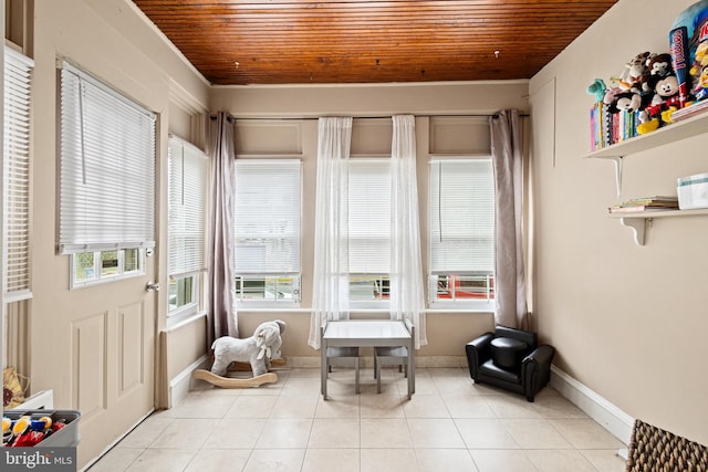 living area with light tile patterned flooring and wood ceiling