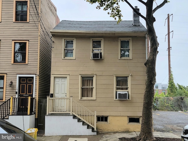 view of front of house featuring cooling unit