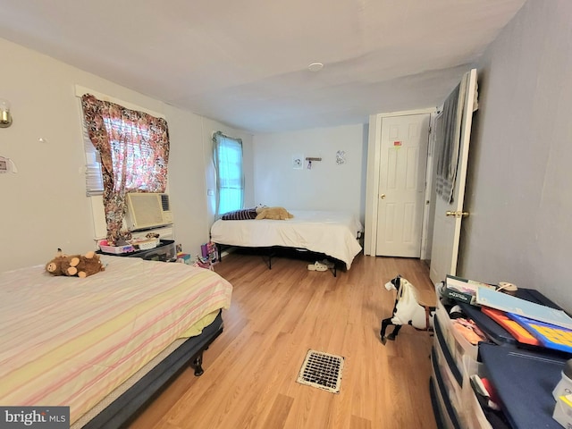 bedroom featuring light hardwood / wood-style floors