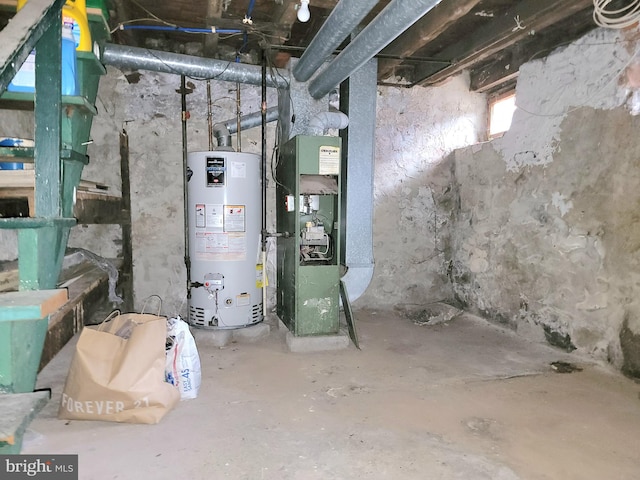 utility room featuring water heater and heating unit