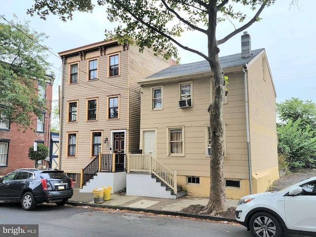 view of front of property featuring cooling unit