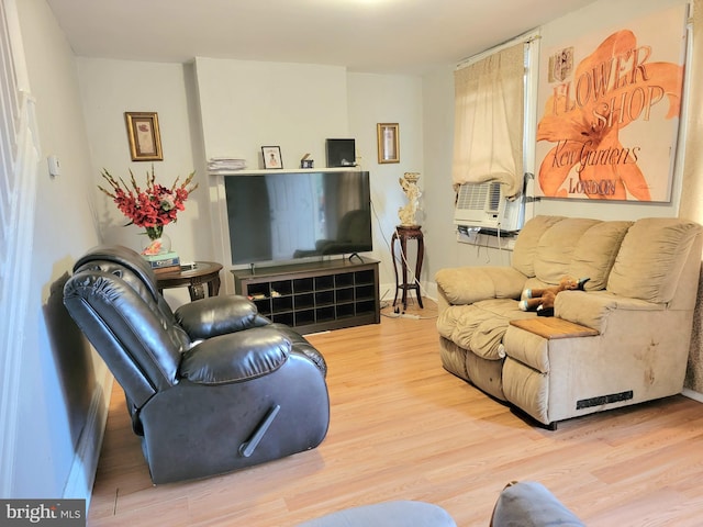 living room featuring light hardwood / wood-style floors and cooling unit