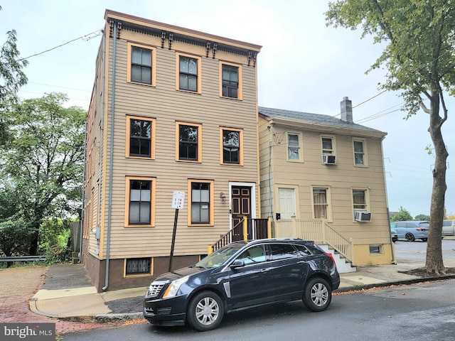 view of front facade featuring cooling unit