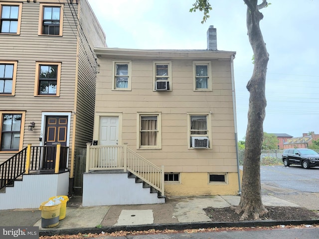 view of front of property with cooling unit