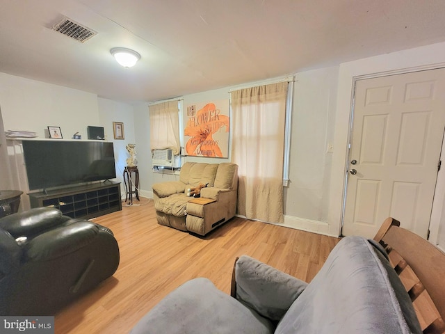 living room featuring hardwood / wood-style floors and cooling unit