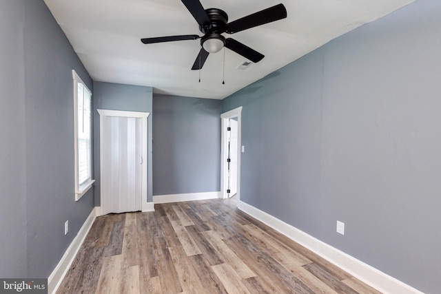 interior space with light hardwood / wood-style floors and ceiling fan