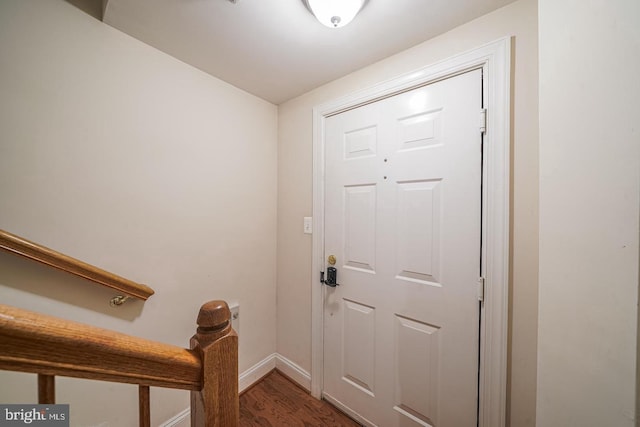 doorway with hardwood / wood-style flooring