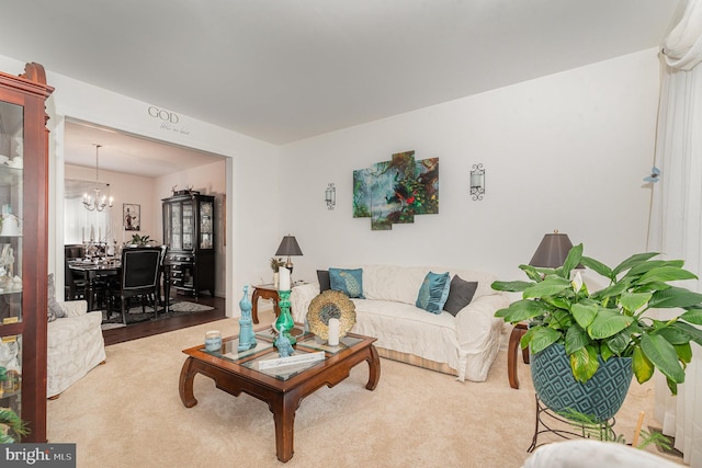 living room featuring a chandelier and hardwood / wood-style flooring