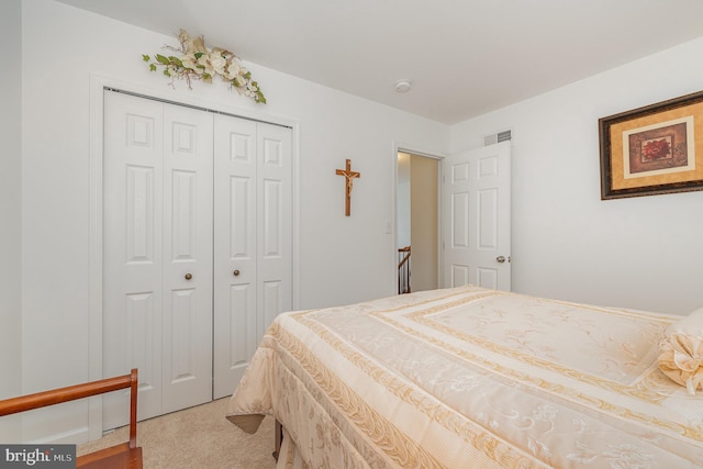 carpeted bedroom featuring a closet