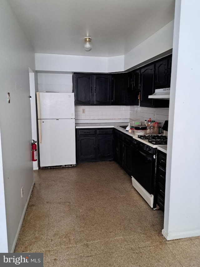 kitchen featuring backsplash and white appliances