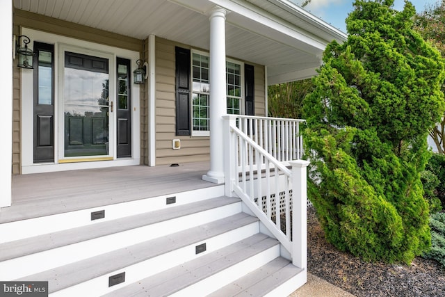 doorway to property featuring covered porch