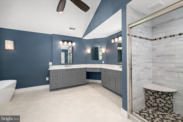 bathroom featuring ceiling fan, vanity, lofted ceiling, and plus walk in shower