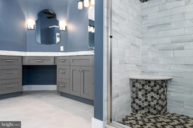 bathroom with tile patterned flooring and vanity