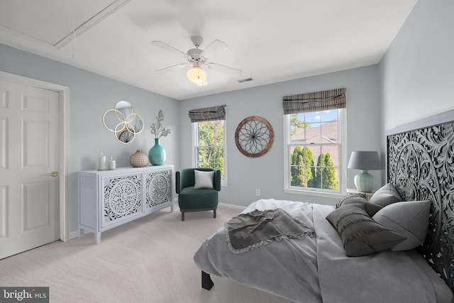 bedroom featuring ceiling fan and light colored carpet