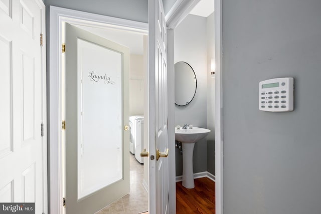 bathroom with sink and washer / clothes dryer