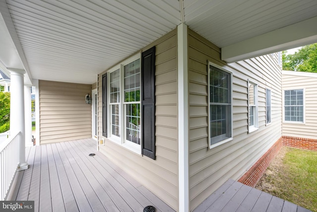 wooden terrace with a porch