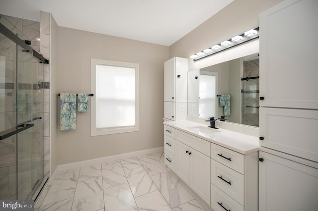 bathroom featuring vanity and a shower with shower door