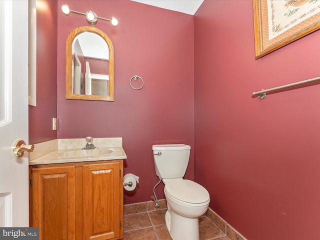 bathroom featuring vanity, toilet, and tile patterned floors