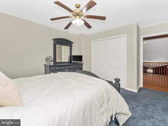 bedroom featuring ceiling fan, a closet, and dark colored carpet