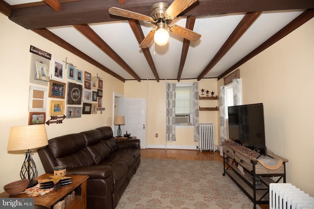 living room featuring ceiling fan, radiator, beam ceiling, and light hardwood / wood-style floors