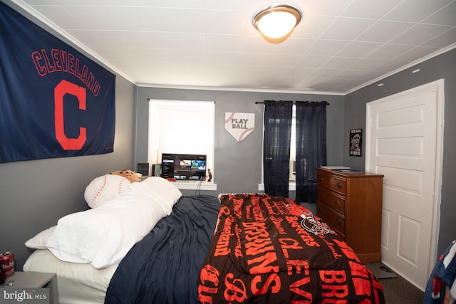 carpeted bedroom with crown molding