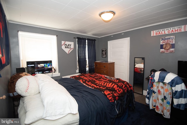 bedroom with carpet floors and ornamental molding