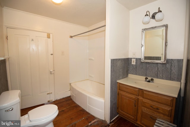 full bathroom with vanity, toilet, shower / washtub combination, crown molding, and hardwood / wood-style floors