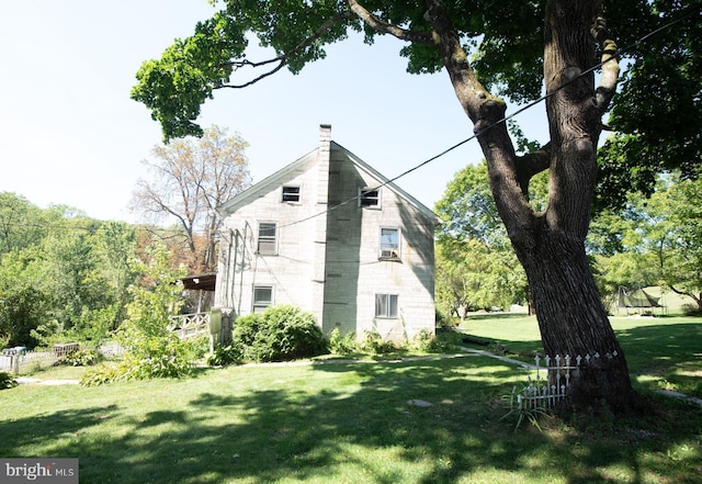 view of home's exterior featuring a yard