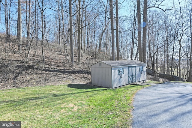 view of outdoor structure with a lawn