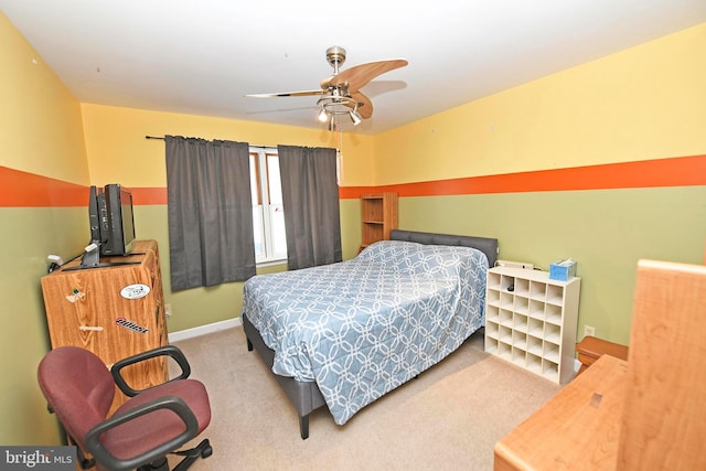 bedroom featuring ceiling fan and light colored carpet