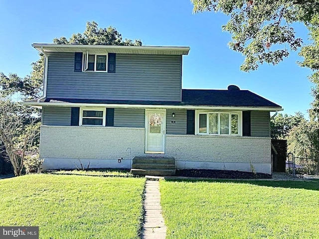 view of property featuring a front yard