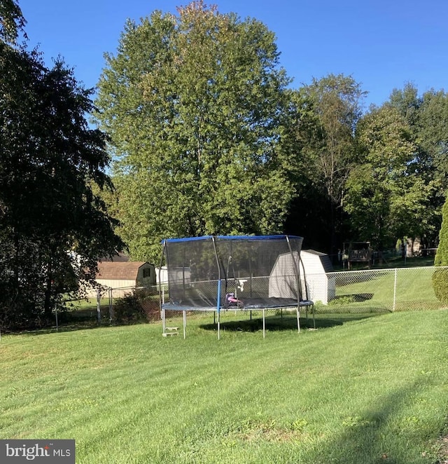 view of yard with a trampoline