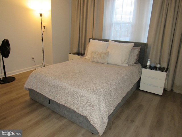 bedroom featuring dark hardwood / wood-style floors