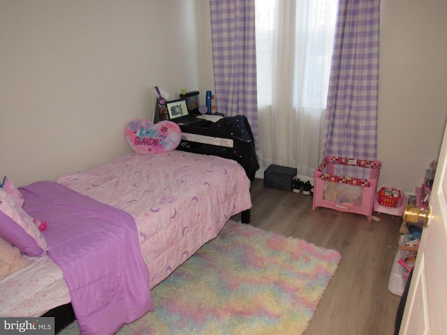 bedroom featuring hardwood / wood-style flooring