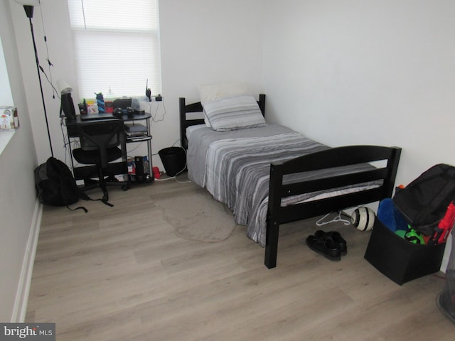 bedroom with light hardwood / wood-style floors