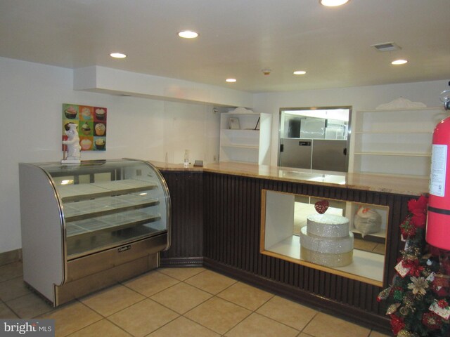 kitchen with light tile patterned flooring