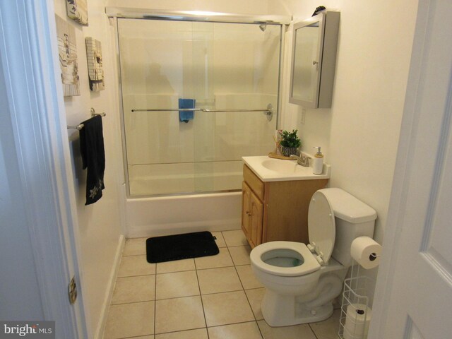 full bathroom with vanity, tile patterned flooring, toilet, and combined bath / shower with glass door