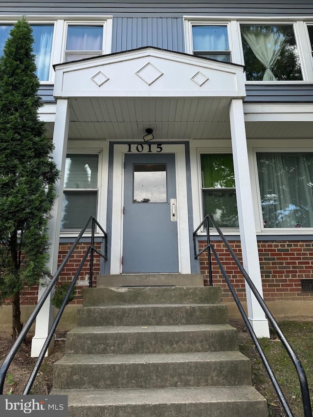 doorway to property with a porch