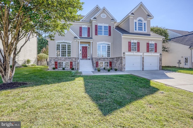 view of front of home with an attached garage, stone siding, driveway, and a front lawn