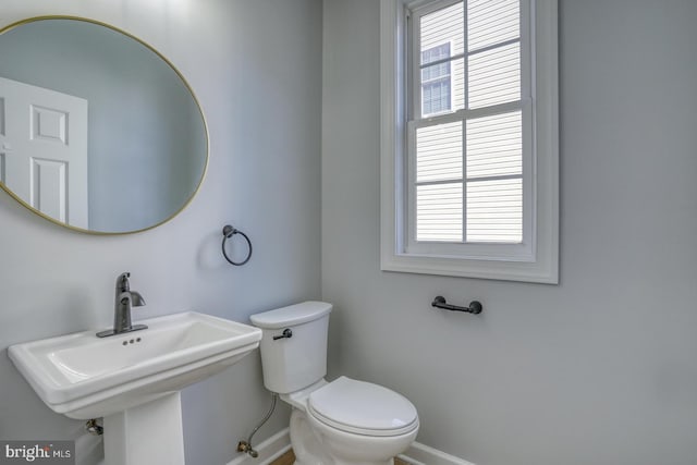 bathroom with sink and toilet