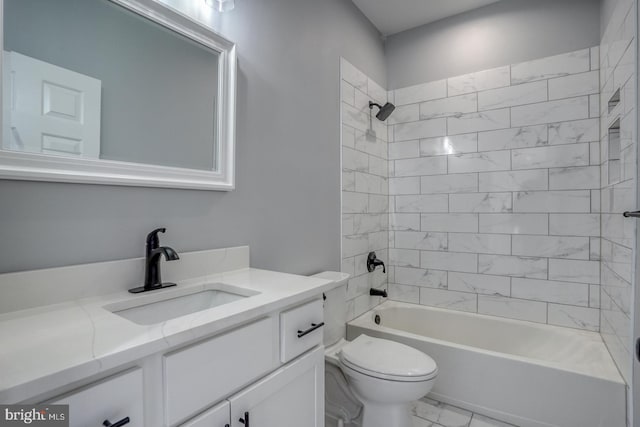 full bathroom featuring vanity, toilet, and tiled shower / bath combo